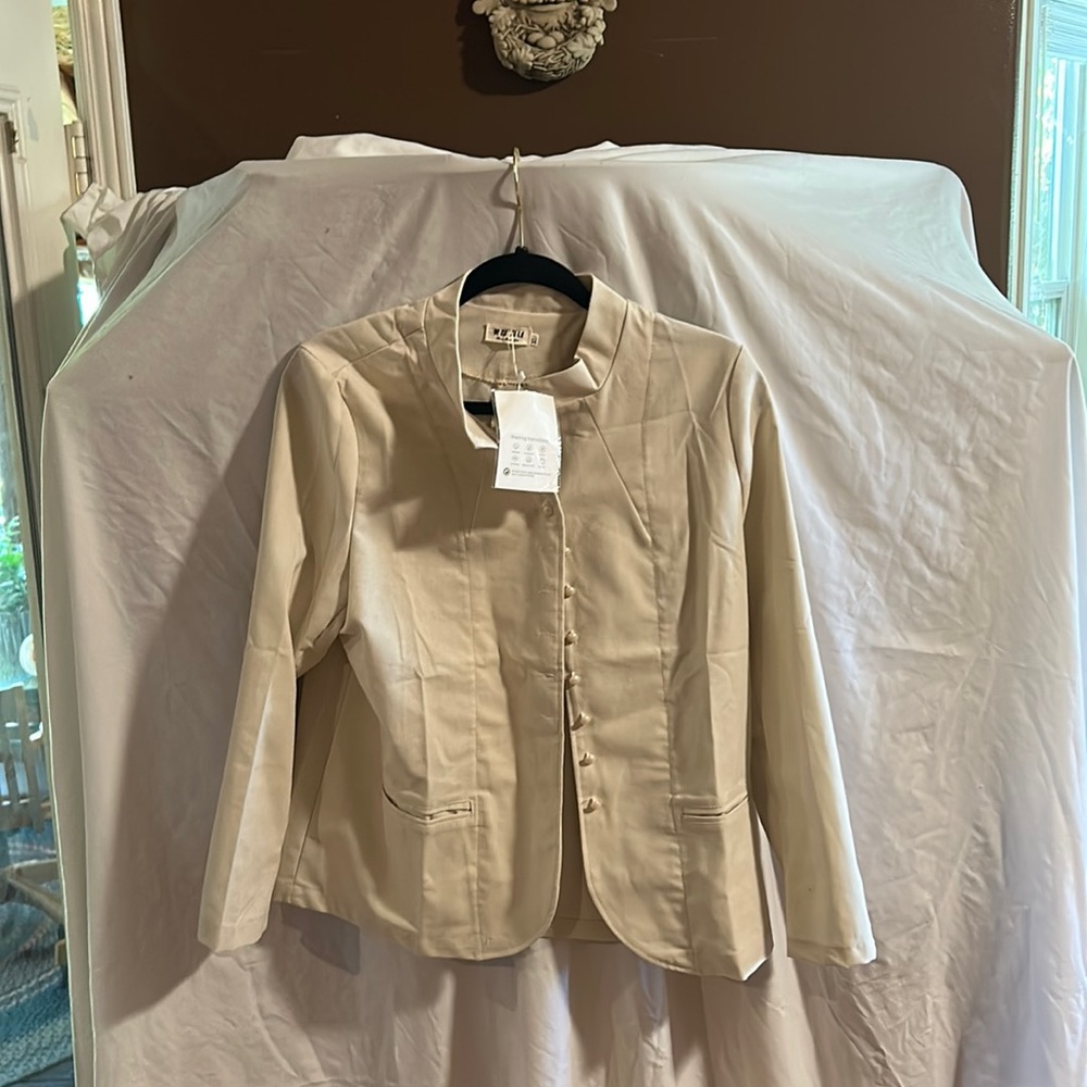 Cream colored linen jacket.